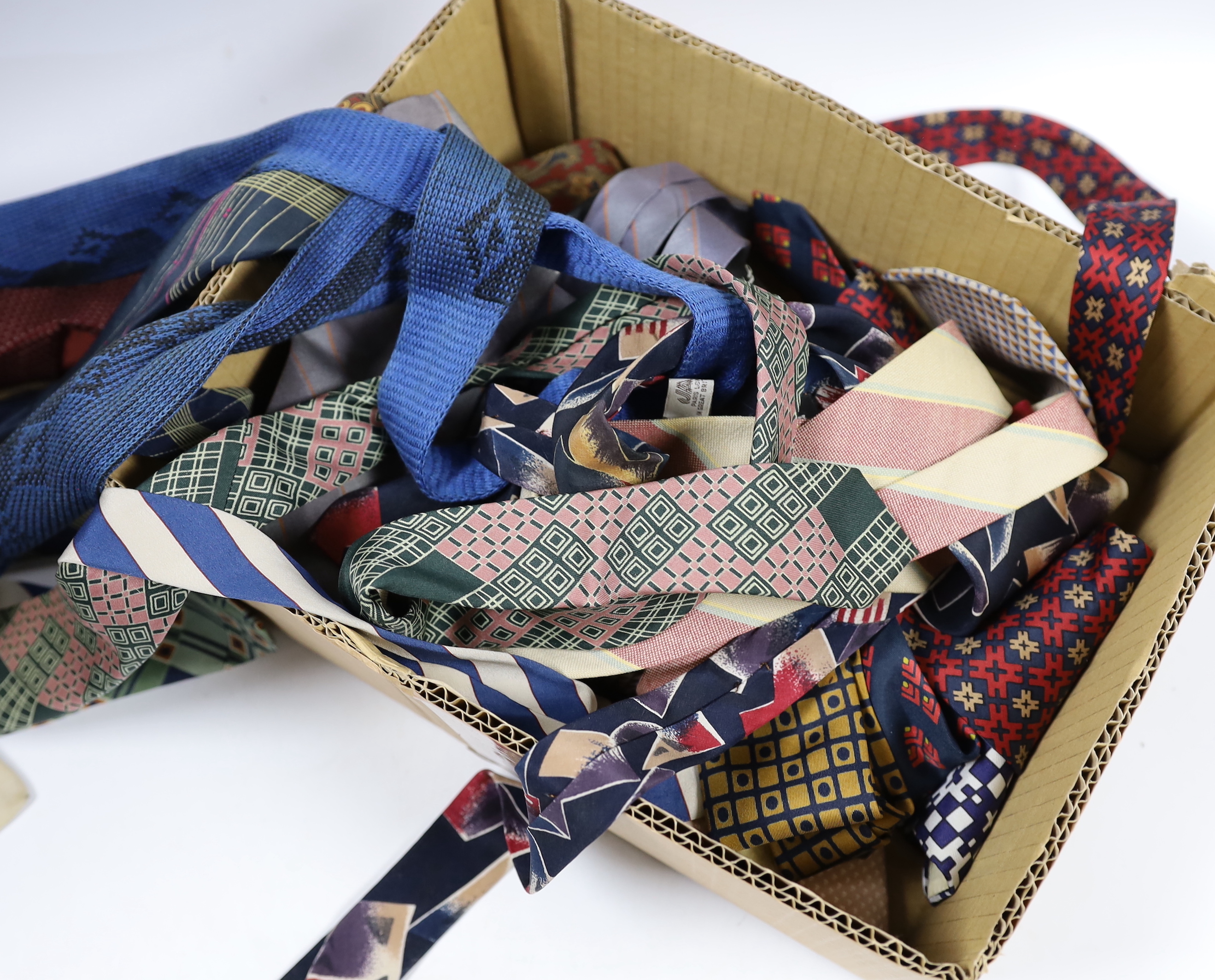 A collection of vintage and later silk ties, some designer including Jaeger, Pierre Cardin, Yves Saint Laurent and Balmain